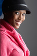 Fashionable Young Woman Wearing Cap And Knitwear In Studio