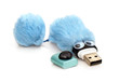 flash memory with eyes and blue fur, close-up