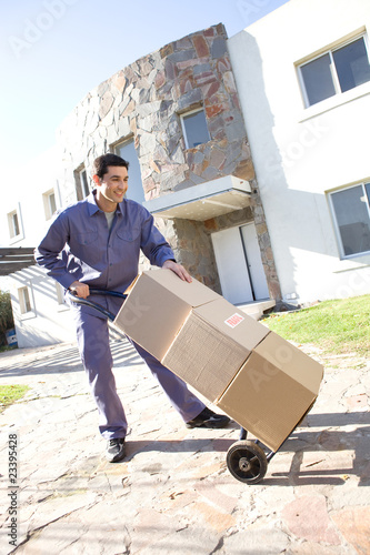 Photo: Man carrying boxes Man carrying boxes