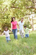Family Enjoying Walk In Park