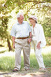 Senior Couple Walking In Park