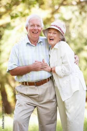 Photo: Senior Couple Walking In Park Senior Couple Walking In Park