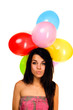 happy teenage girl with balloons over white