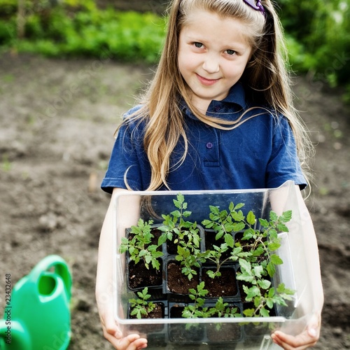 Photo: Girl with seedlings Girl with seedlings