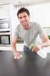 Photo: Young Man Cleaning Modern Kitchen Young Man Cleaning Modern Kitchen