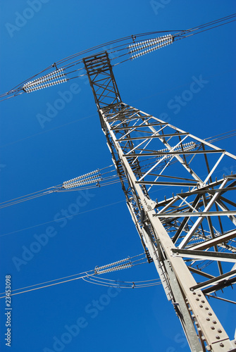 Photo: Electricity Pylon Against Blue Sky Electricity Pylon Against Blue Sky