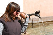 Girl drinking with a copper glass Girl drinking with a copper glass