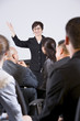 Photo: Hispanic woman speaking to group of businesspeople Hispanic woman speaking to group of businesspeople