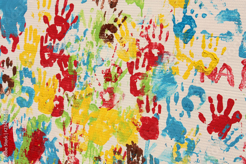 Photo: Handprints in different colors in a mural. Handprints in different colors in a mural.