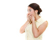 Photo: shocked girl closing her mouth with hands over white shocked girl closing her mouth with hands over white