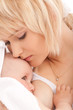 Mother breast feeding her newborn baby girl