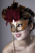 Beautiful girl with a carnival mask