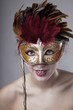 Beautiful girl with a carnival mask