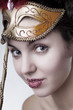 Beautiful girl with a carnival mask