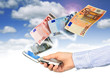 Mobile phone and euro money.