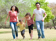 Foto: Family running on the park Family running on the park