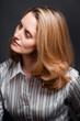 Woman looking away wearing striped shirt