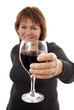 Woman holding out glass of red wine