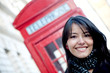 Woman outside a telephone booth