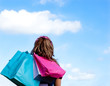 Caucasian woman holding shopping bags outdoor