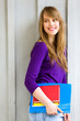 Female student holding books