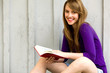 Female student reading book