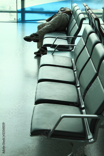Photo: sleeping traveller on the bench sleeping traveller on the bench