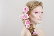 Woman with pink flowers in hair