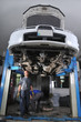 Auto mechanics working under the car - a series of MECHANIC Auto mechanics working under the car - a series of MECHANIC