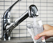 Filling glass of tap water Filling glass of tap water