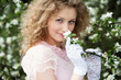lovely blonde in blooming garden