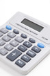 Calculator on top of newspaper with $ figurer amounts