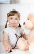 little girl doctor with teddy bear