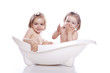 children in white bath tub