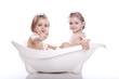 children in white bath tub