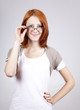 Young smiling businesswomen in white with glasses.