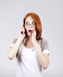 Young Businesswomen in white speaking by mobile phone.