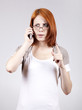 Young Businesswomen in white speaking by mobile phone.