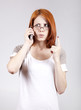 Young Businesswomen in white speaking by mobile phone.