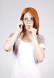 Young Businesswomen in white speaking by mobile phone.