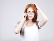 Young Businesswomen in white speaking by mobile phone.