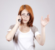 Young Businesswomen in white speaking by mobile phone.