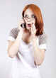 Young Businesswomen in white speaking by mobile phone.