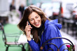 Happy young lady talking on mobile phone Happy young lady talking on mobile phone
