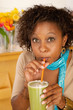 Photo: Woman Drinking a Smoothie Woman Drinking a Smoothie