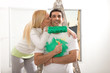 Woman kissing her husband