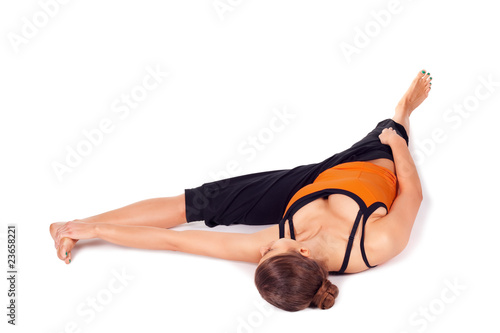 Photo: Fit Woman Practicing Reclining Big Toe Yoga Pose Fit Woman Practicing Reclining Big Toe Yoga Pose