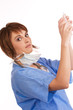 Foto: Young Caucasian female doctor holding filled syringe Young Caucasian female doctor holding filled syringe