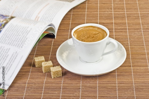 Photo: Cup of coffee and a magazine Cup of coffee and a magazine
