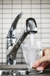 Filling glass of tap water Filling glass of tap water